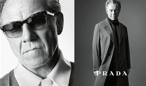 who owns prada brand.